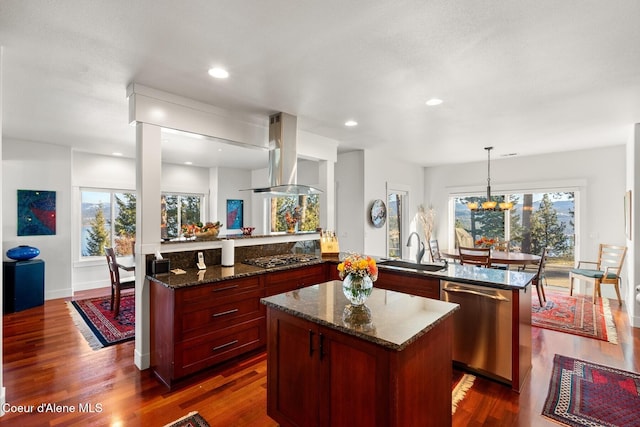 5006 S Brentwood Ln, Coeur Dalene, ID 83814 - kitchen featuring a peninsula, island exhaust hood, stainless steel appliances, pendant lighting, and a sink