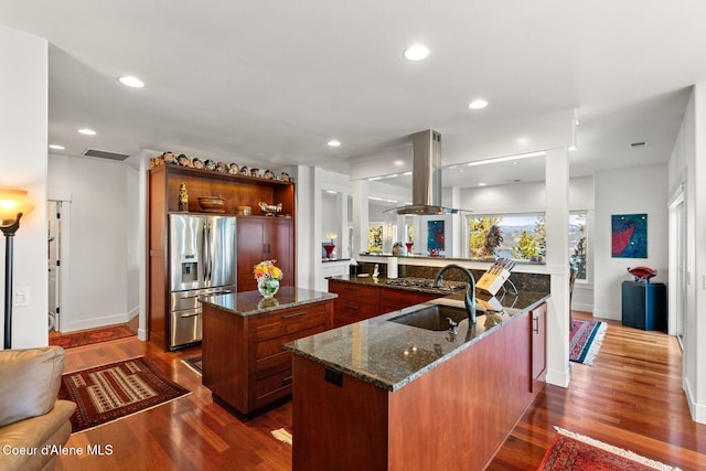 5006 S Brentwood Ln, Coeur Dalene, ID 83814 - kitchen with visible vents, island range hood, a center island, a peninsula, and stainless steel refrigerator with ice dispenser