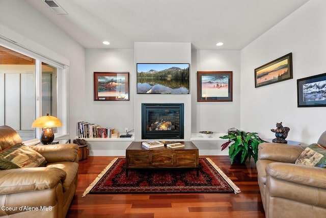 5006 S Brentwood Ln, Coeur Dalene, ID 83814 - living area featuring a glass covered fireplace, visible vents, recessed lighting, and wood finished floors