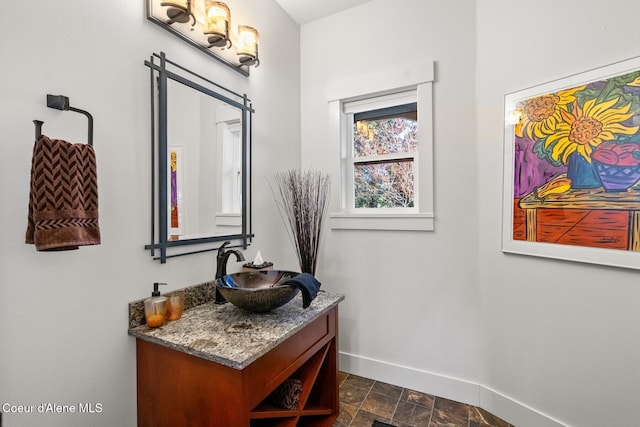 5006 S Brentwood Ln, Coeur Dalene, ID 83814 - bathroom featuring vanity and baseboards