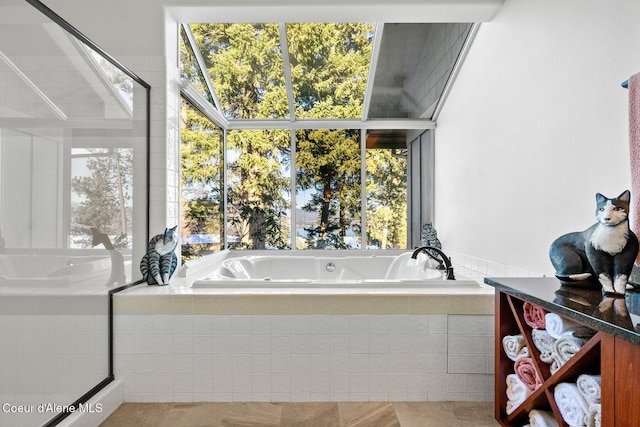 5006 S Brentwood Ln, Coeur Dalene, ID 83814 - bathroom featuring plenty of natural light and tiled tub