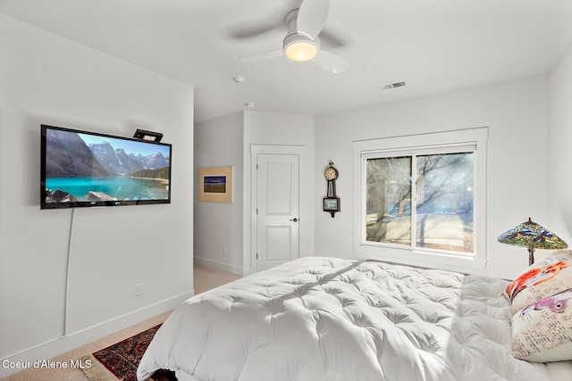 5006 S Brentwood Ln, Coeur Dalene, ID 83814 - bedroom featuring a ceiling fan, light colored carpet, visible vents, and baseboards