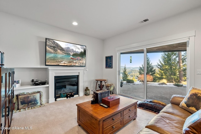 5006 S Brentwood Ln, Coeur Dalene, ID 83814 - living area with light carpet, recessed lighting, visible vents, and a glass covered fireplace