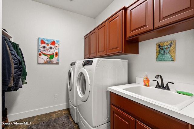 5006 S Brentwood Ln, Coeur Dalene, ID 83814 - clothes washing area with a sink, baseboards, washer and dryer, cabinet space, and stone finish floor