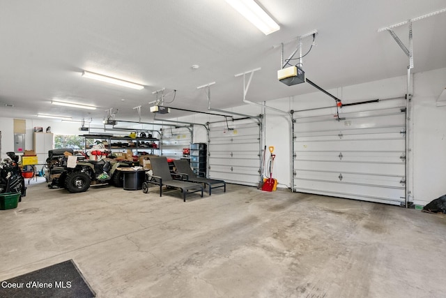 5006 S Brentwood Ln, Coeur Dalene, ID 83814 - garage with a garage door opener and electric panel
