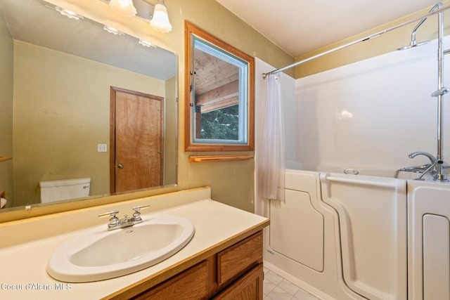 bathroom featuring toilet and vanity