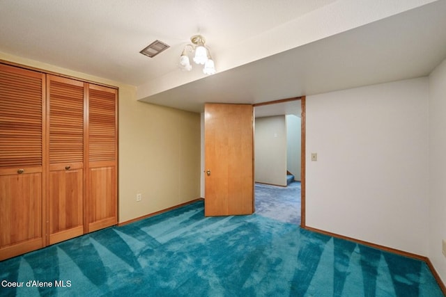 carpeted bedroom with baseboards, visible vents, and a closet