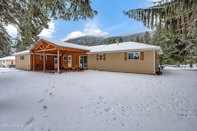 view of snow covered house