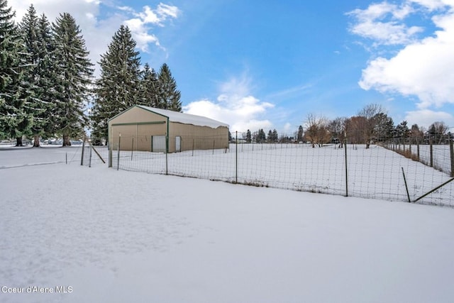 view of yard featuring a garage and fence