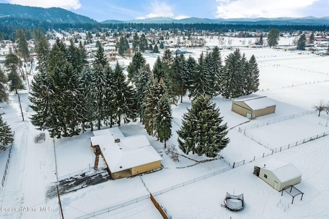 snowy aerial view with a mountain view