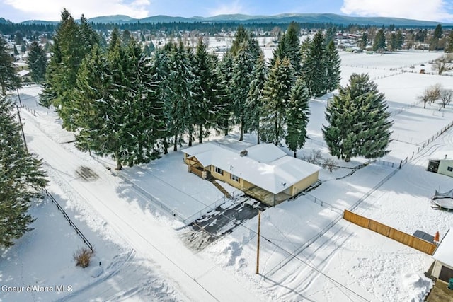 snowy aerial view with a mountain view