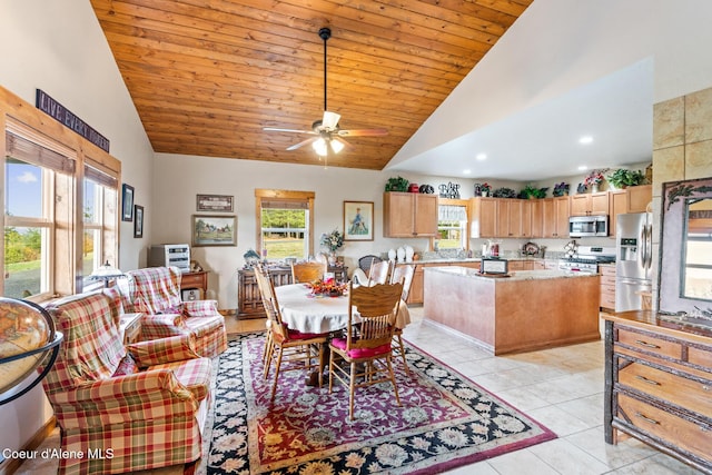 dining space featuring light tile patterned floors, high vaulted ceiling, wooden ceiling, and a ceiling fan