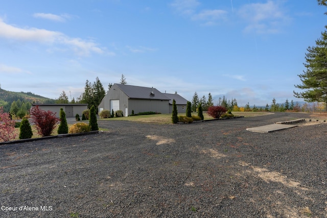 exterior space with a garage and an outdoor structure