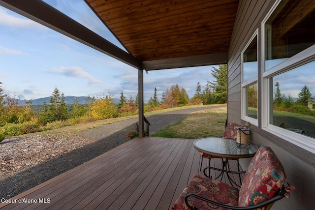 wooden terrace with a mountain view