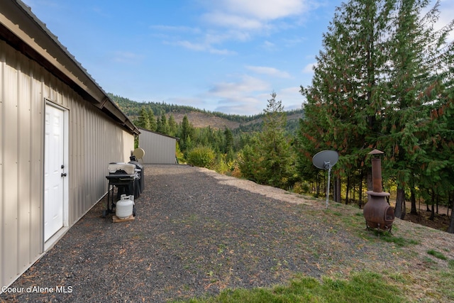 view of yard with a wooded view