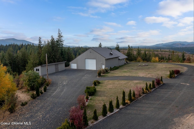 exterior space featuring a wooded view