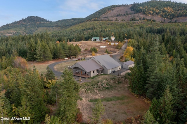 aerial view featuring a mountain view and a view of trees