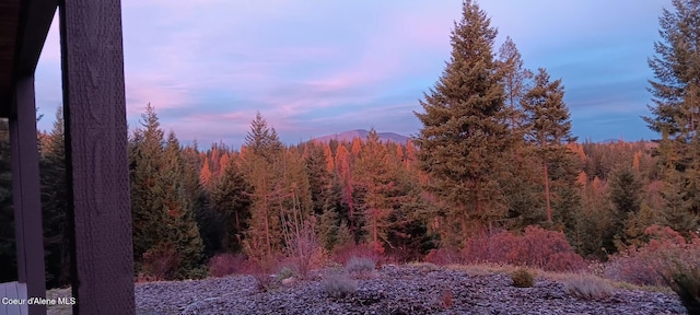 view of local wilderness with a view of trees