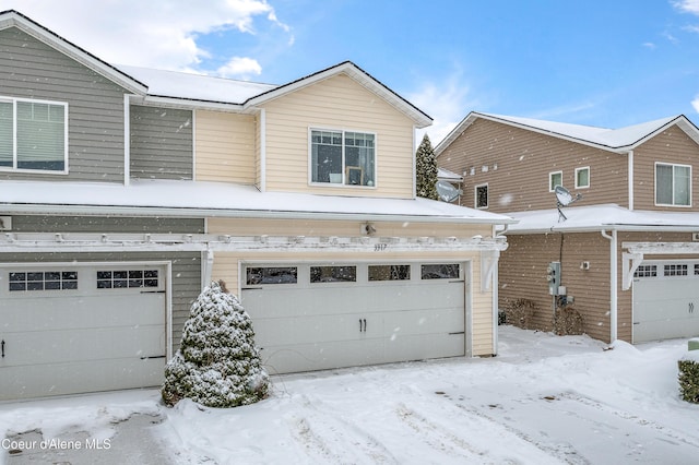 view of snow covered garage