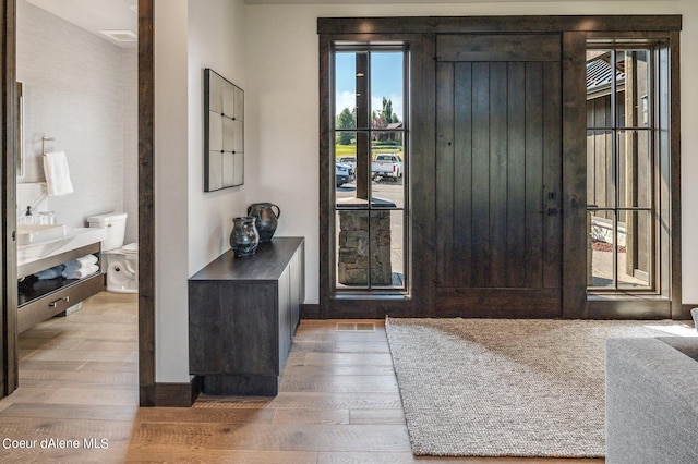 entryway with wood finished floors