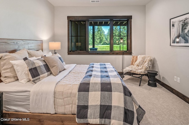 bedroom featuring carpet, visible vents, and baseboards