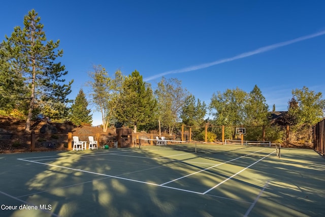 view of sport court featuring fence