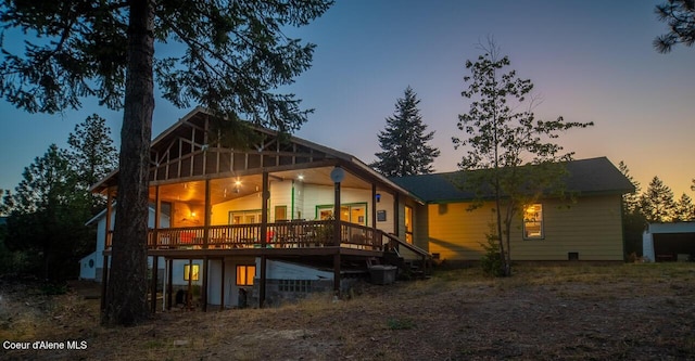 1600 Patches Ln, Saint Maries, ID 83861 - back of property at dusk with a deck and central AC unit
