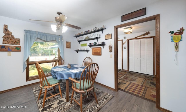 dining space featuring ceiling fan, wood finished floors, and baseboards