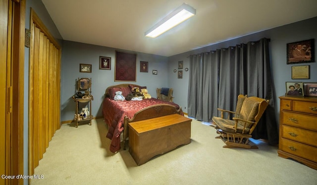 bedroom featuring light colored carpet