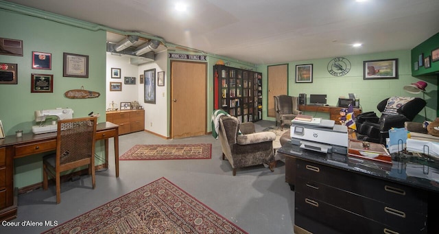 office space featuring concrete block wall and finished concrete flooring