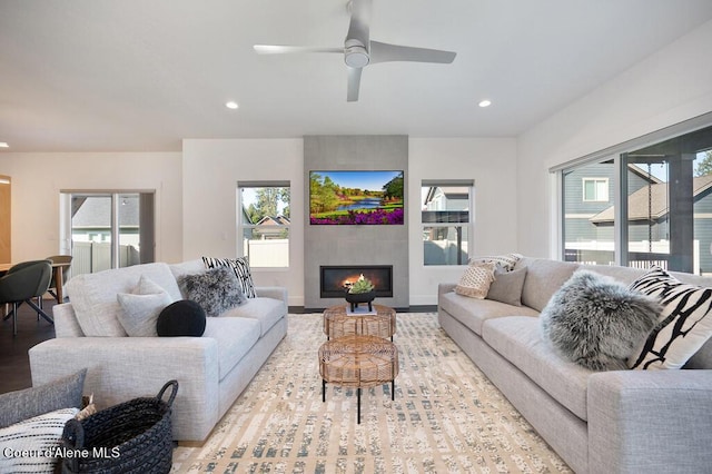 living area with plenty of natural light, a fireplace, and recessed lighting