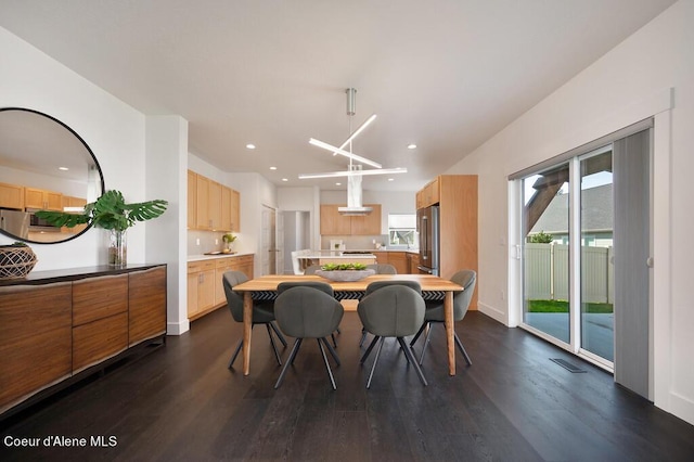 dining room featuring baseboards, dark wood finished floors, and recessed lighting