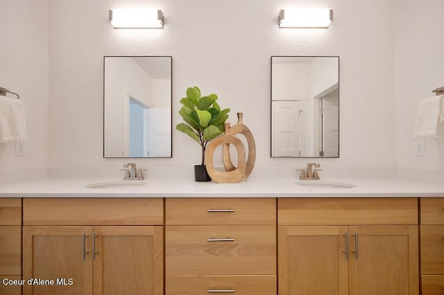 full bath featuring double vanity and a sink