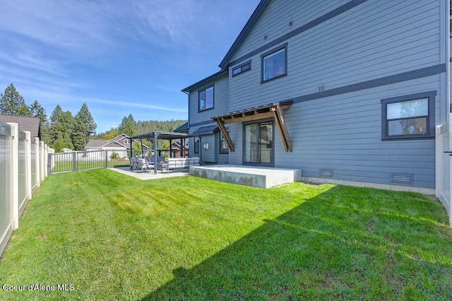 back of house with a lawn, a fenced backyard, crawl space, a patio area, and a pergola