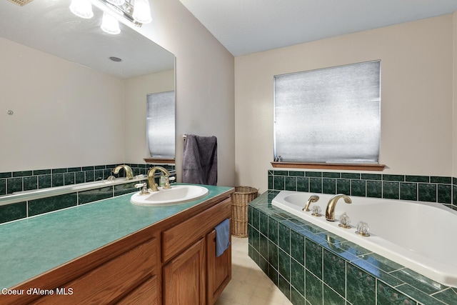 full bathroom featuring a garden tub and vanity