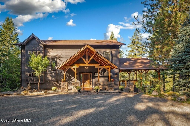 rustic home featuring covered porch