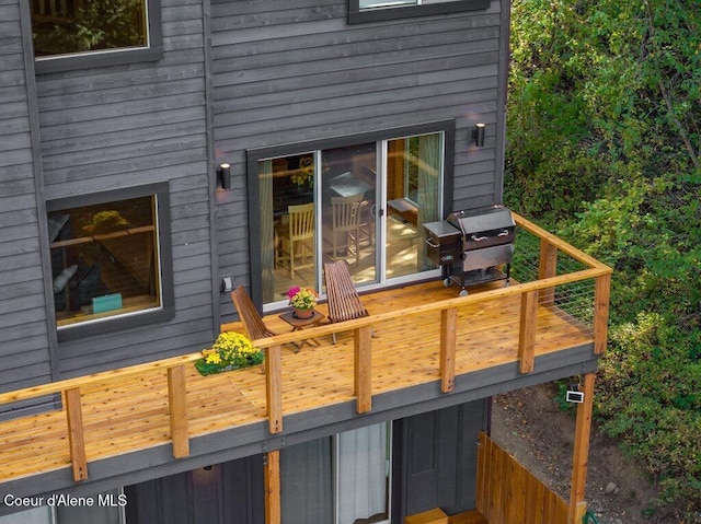 wooden deck with grilling area