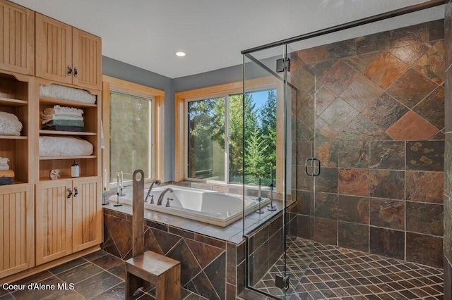 full bath featuring recessed lighting, a garden tub, and a shower stall