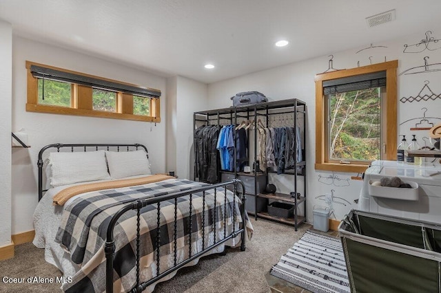 bedroom featuring carpet, multiple windows, visible vents, and recessed lighting