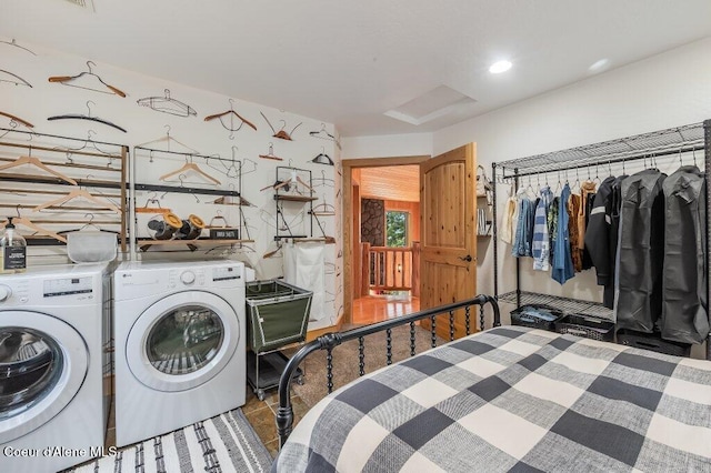 washroom with laundry area, washer and clothes dryer, and recessed lighting