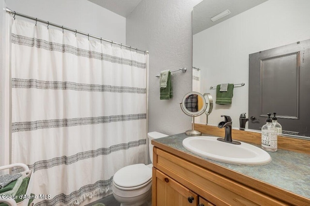 full bathroom with a shower with shower curtain, a textured wall, vanity, and toilet