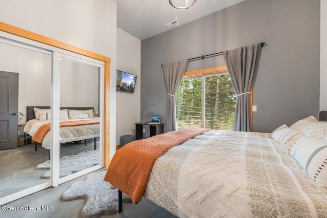 bedroom with a closet and visible vents