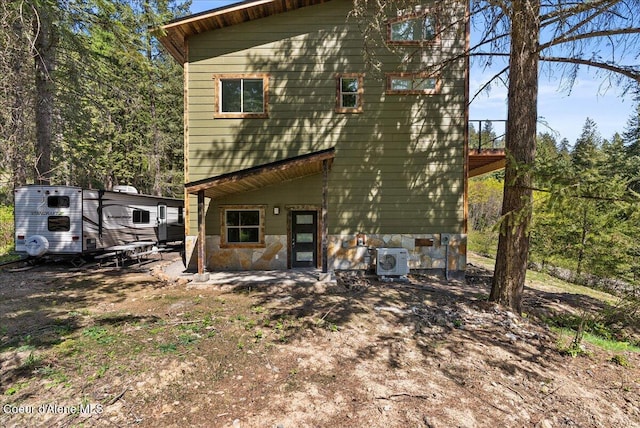 21941 S Lakeview Dr, Worley, ID 83876 - rear view of house with ac unit