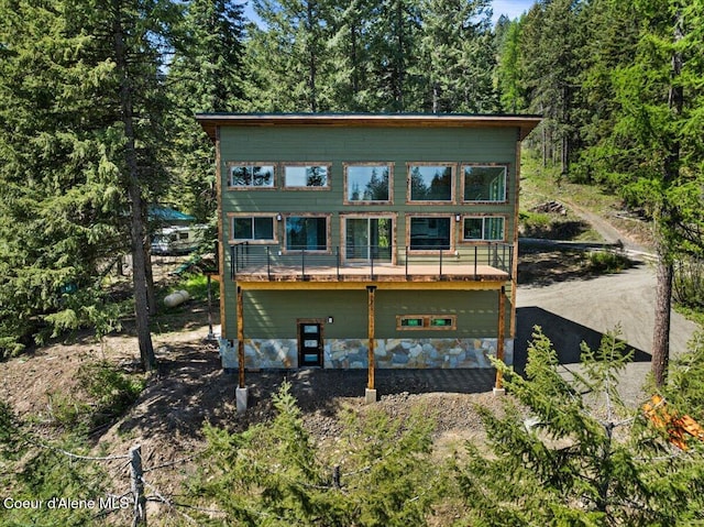 21941 S Lakeview Dr, Worley, ID 83876 - back of house with a wooded view