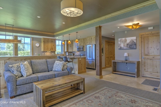 living room featuring recessed lighting, a raised ceiling, visible vents, and crown molding