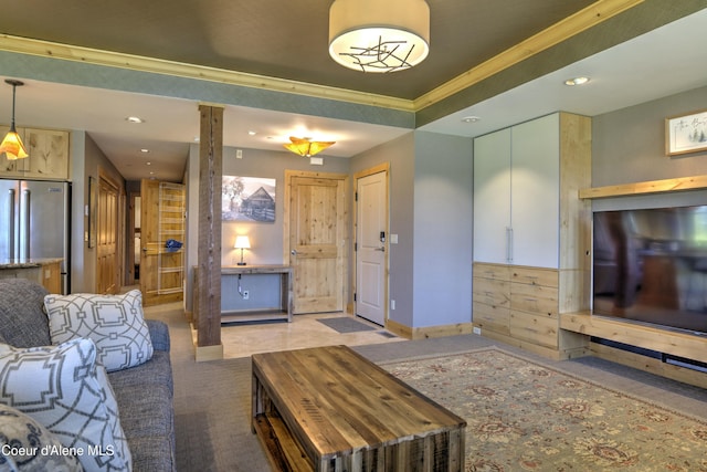 living room featuring light carpet, decorative columns, baseboards, crown molding, and recessed lighting