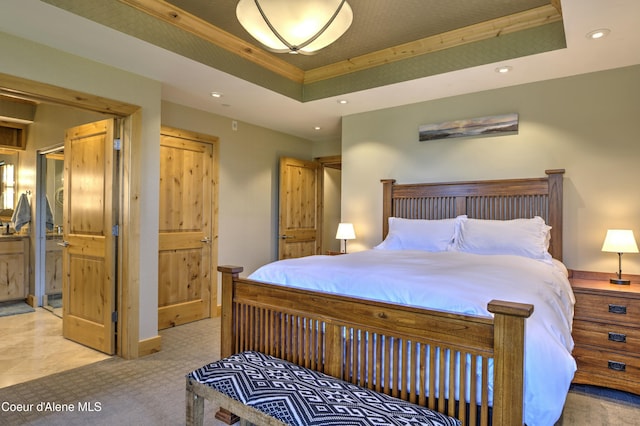 bedroom featuring baseboards, a tray ceiling, carpet, and recessed lighting