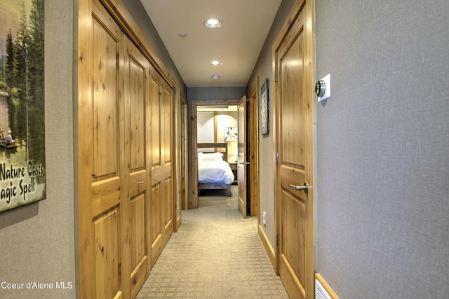 hallway featuring recessed lighting and light colored carpet