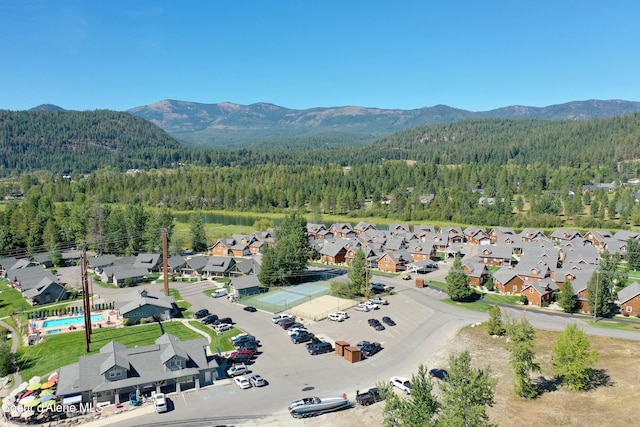 aerial view featuring a mountain view and a wooded view