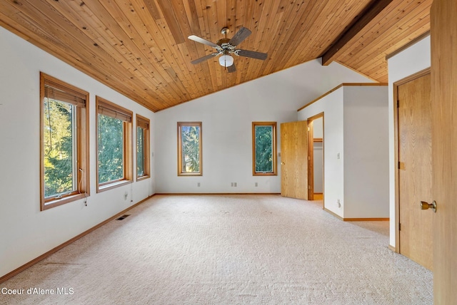 spare room featuring vaulted ceiling with beams, wooden ceiling, baseboards, and light colored carpet